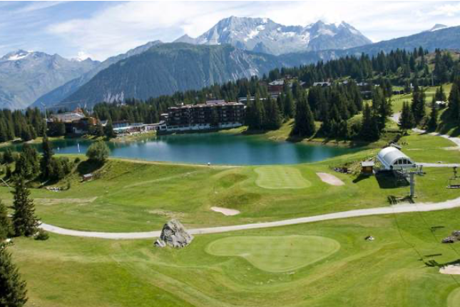 Golf course and reservoir lake in Courchevel 1850.