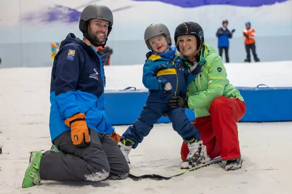 Disabled child learning to ski